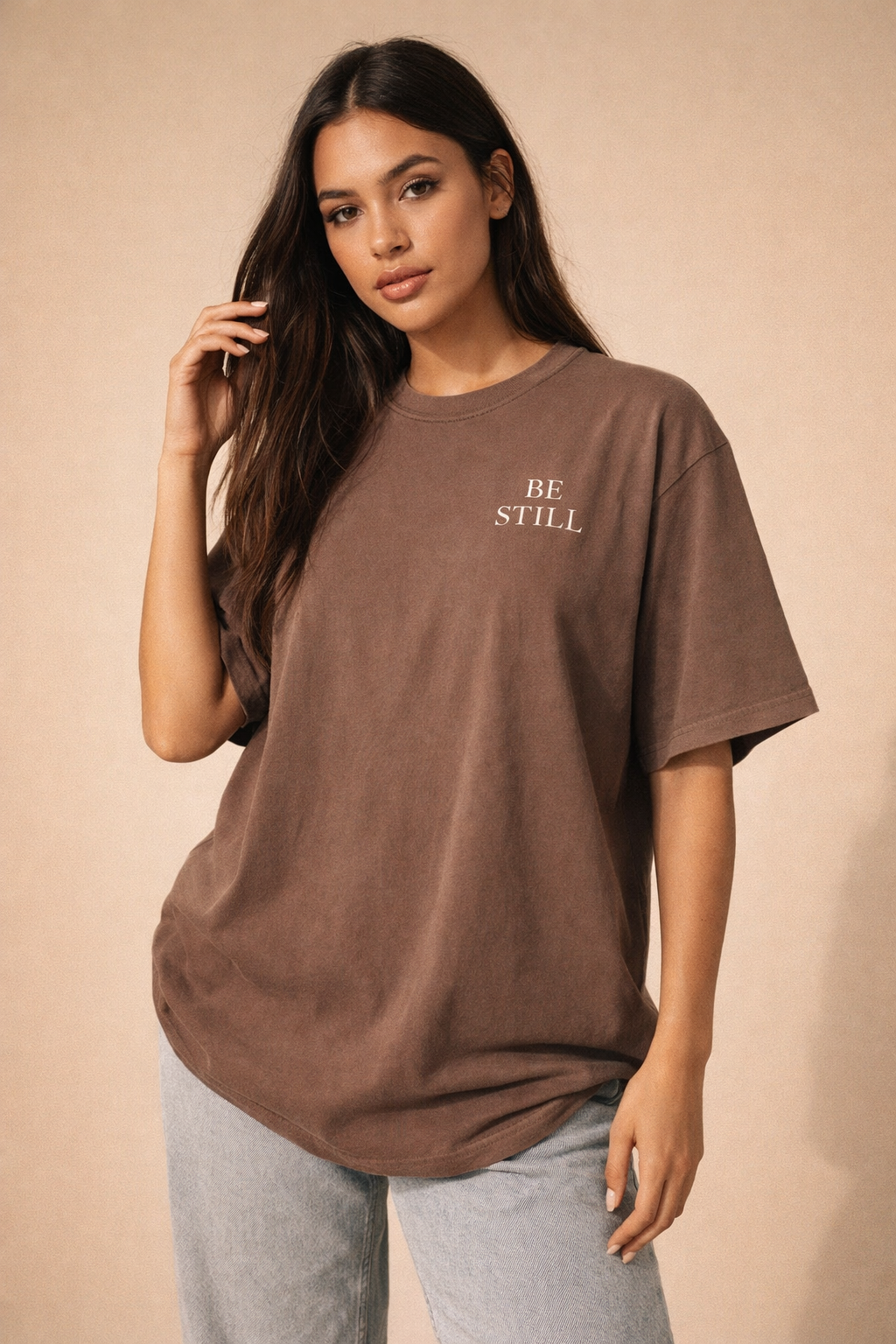 Oversized vintage black t-shirt with ‘Be Still’ faith design for women