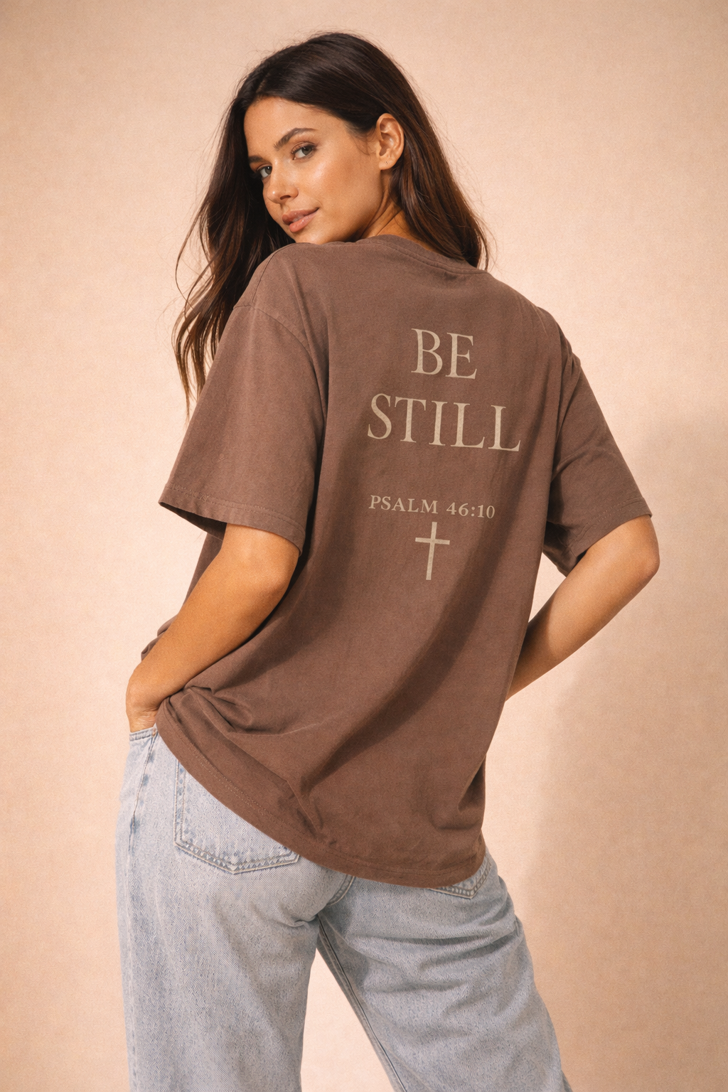Oversized vintage black t-shirt with ‘Be Still’ faith design for women
