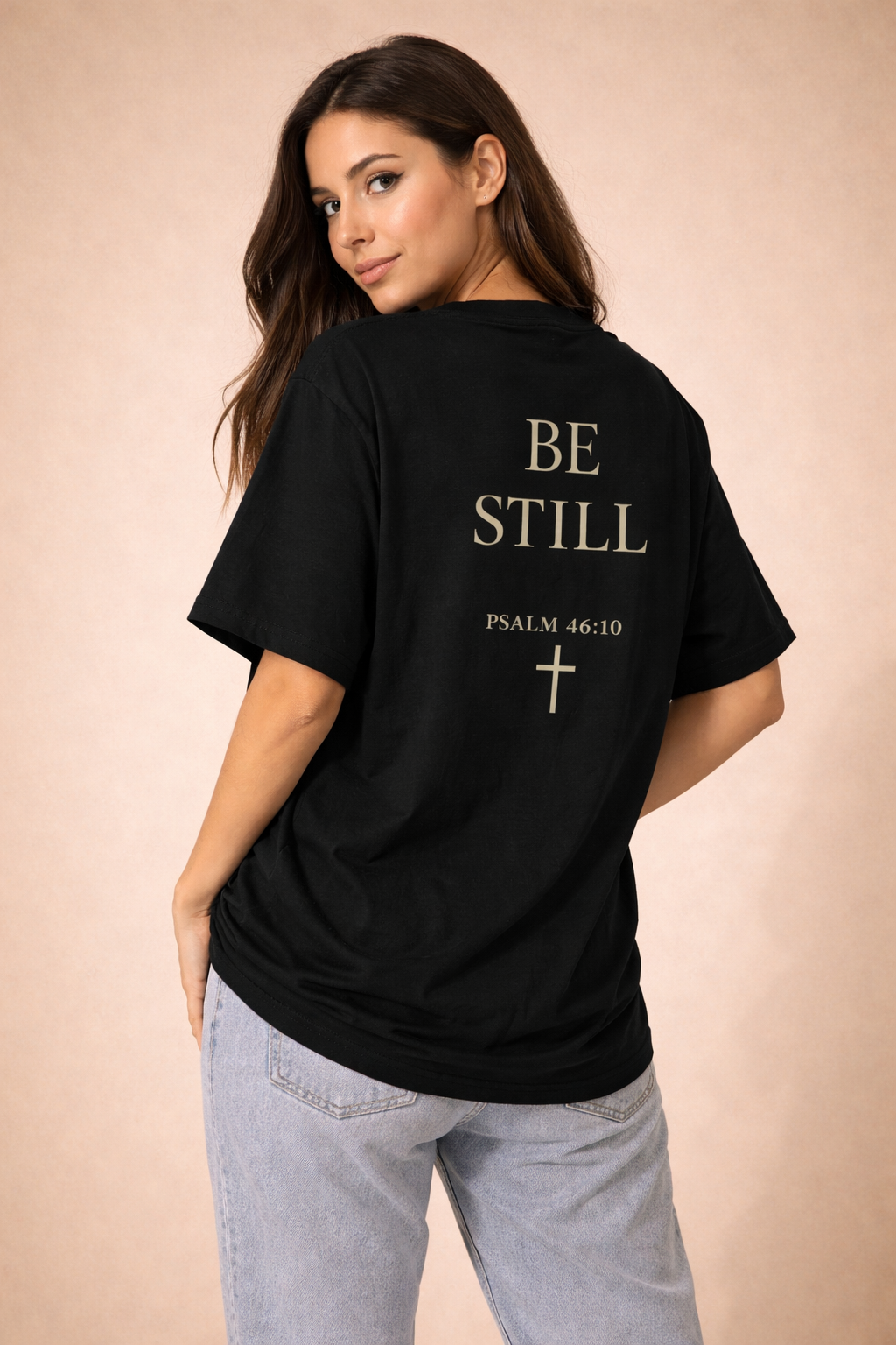 Oversized vintage black t-shirt with ‘Be Still’ faith design for women