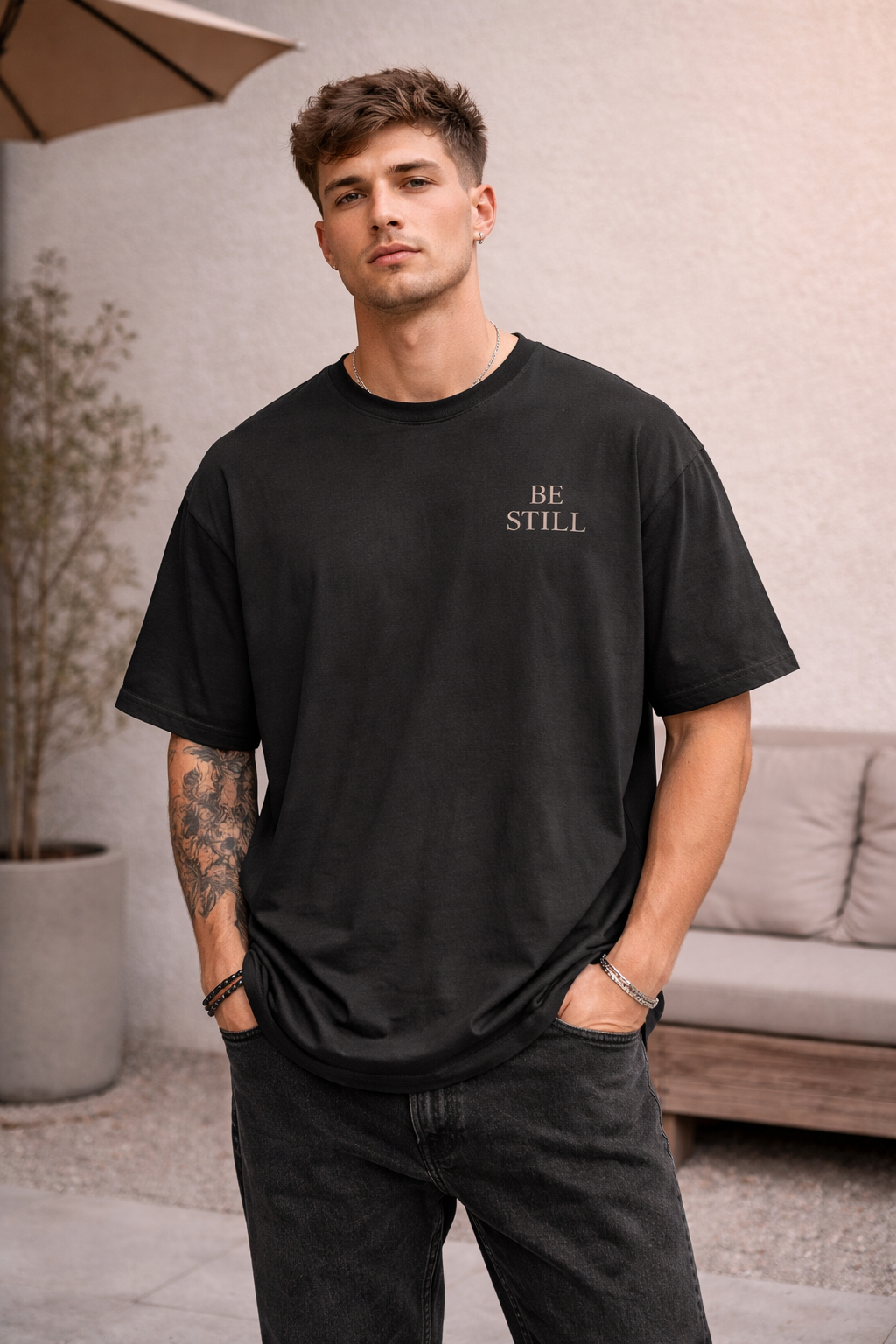 Oversized vintage black t-shirt with ‘Be Still’ faith design