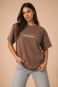 Oversized brown Comfort Colors t-shirt with colorful “Blessed mama” graphic, modeled by woman in neutral studio setting