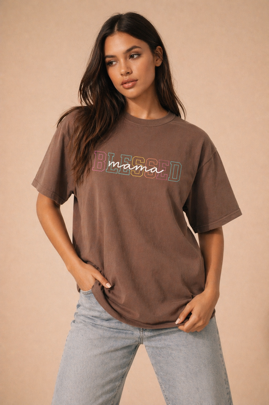 Oversized brown Comfort Colors t-shirt with colorful “Blessed mama” graphic, modeled by woman in neutral studio setting