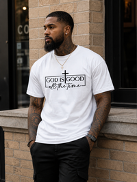 White Christian graphic t-shirt featuring God Is Good All The Time design with cross and minimalist black lettering.
